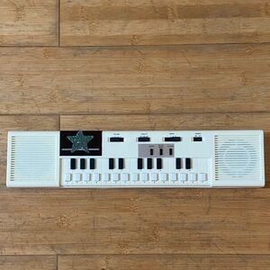 Vintage White Electronic Keyboard Black Keys